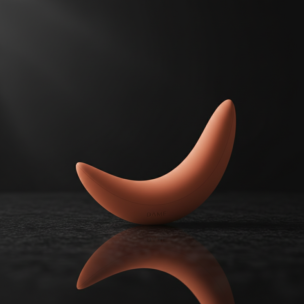 Dame Arc G-spot vibrator on dark luxury surface